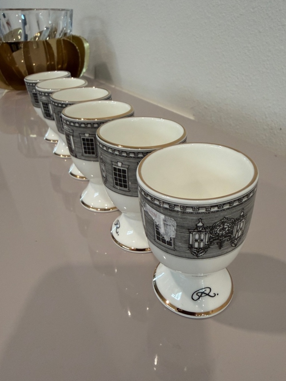 White and Gold Porcelain Egg Cup Set with Architectural Motif